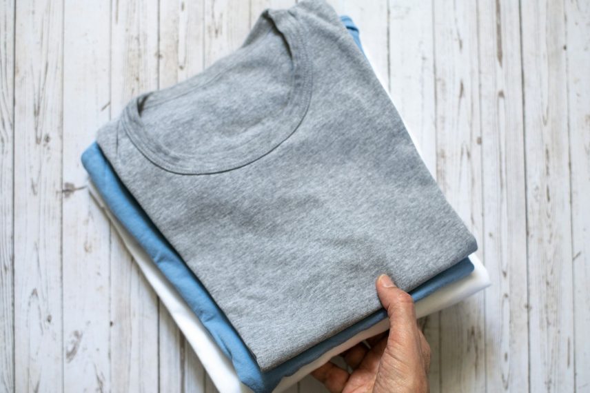 Folded pastel-colored T-shirts