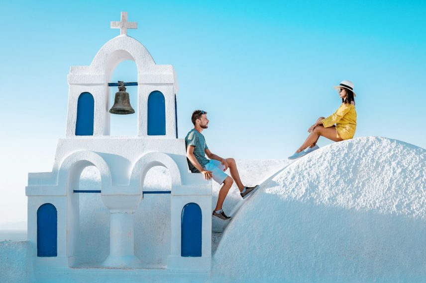 couple honeymoon on vacation Greece visisting Oia Santorini