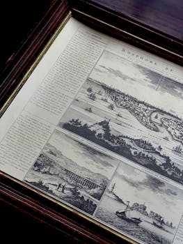 Close-up of a framed art print with archival mat and UV glass, showing protective layers