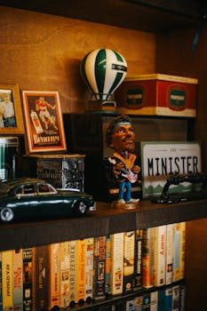 A neatly arranged display shelf featuring various collectible souvenir series including mugs and pins