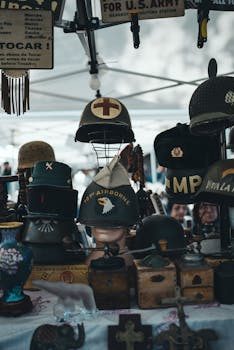 A collection of military helmets and memorabilia displayed on a shelf