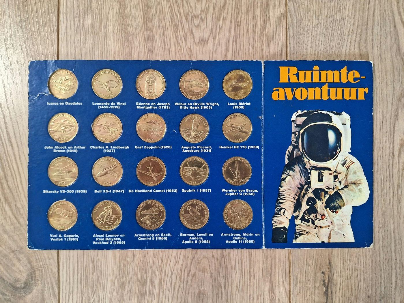 Blue display of space-themed tokens and an astronaut illustration