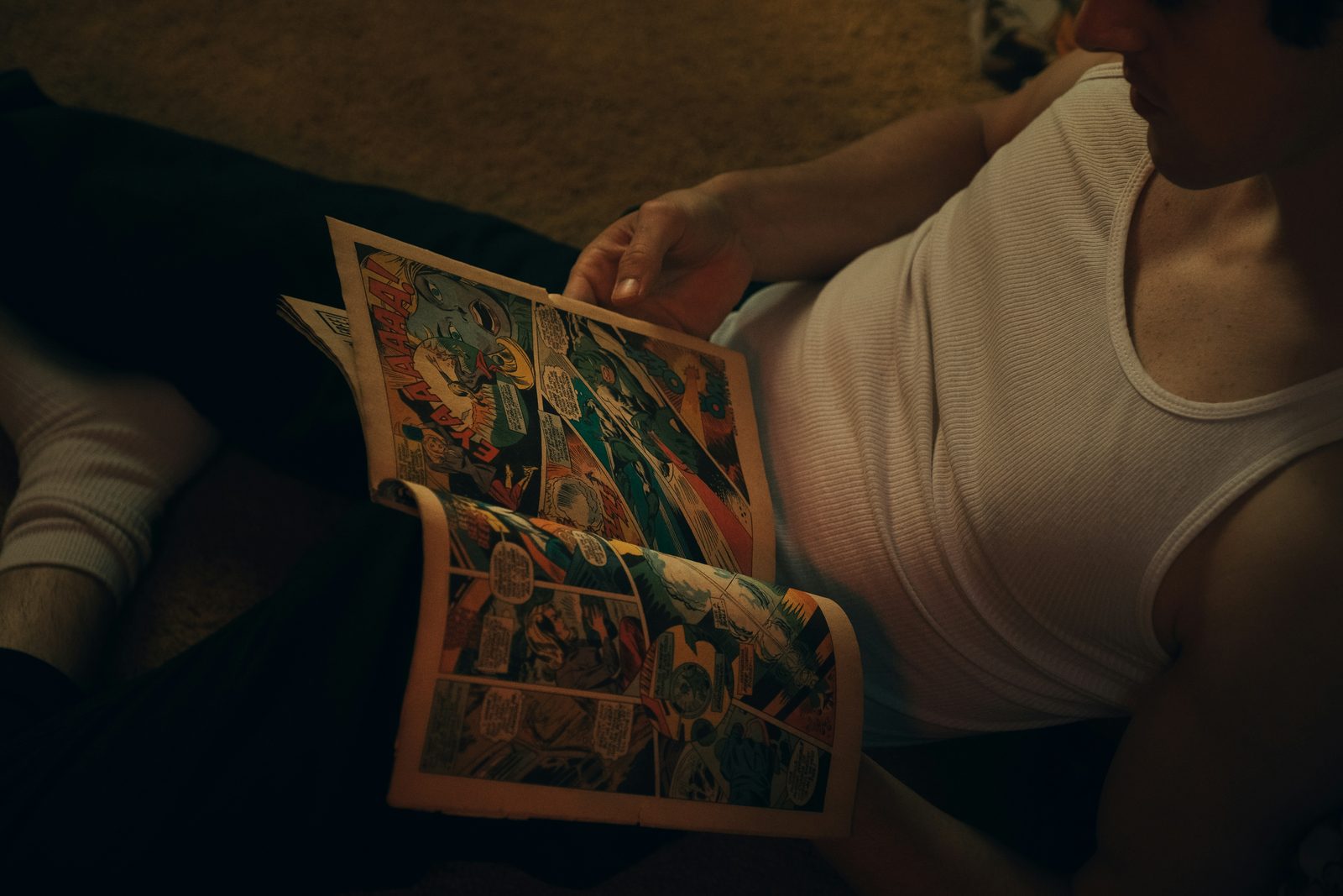 person holding a white and red book