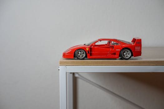 Vintage Hot Wheels redline cars in original blister packs hanging on a pegboard