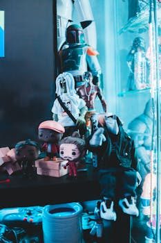 Wooden riser displaying a vintage toy collection on a dark shelf